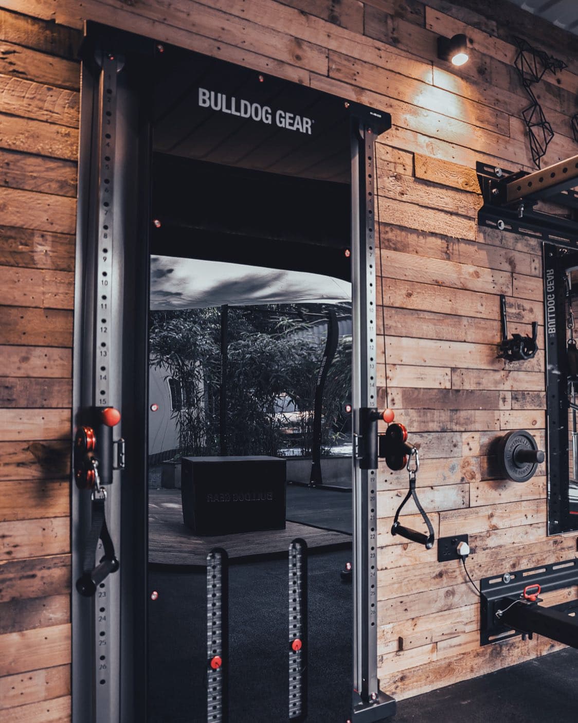 The Yard Fitness studio's sliding door, open to the outdoor training area